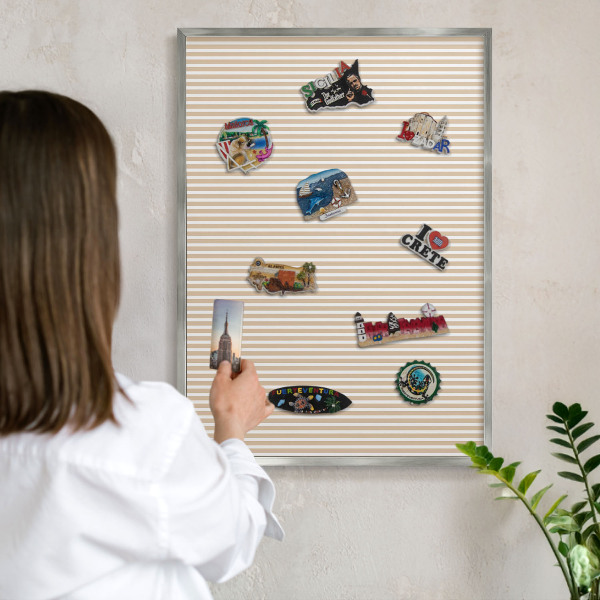 Souvenir magnet display board with a silver frame Vertical stripes