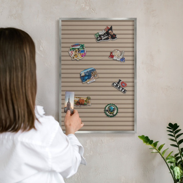 Souvenir magnet display board with a silver frame Vertical stripes