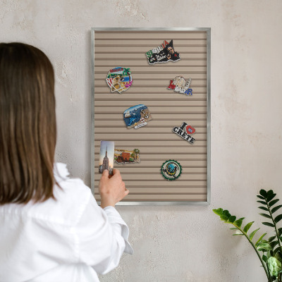 Souvenir magnet display board with a silver frame Vertical stripes