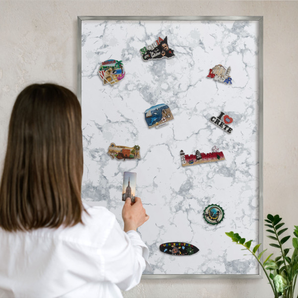 Souvenir magnet display board with a silver frame Marble aesthetics