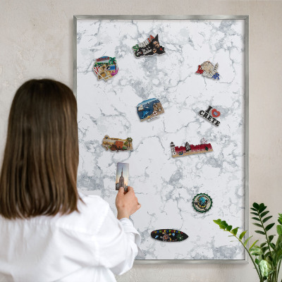 Souvenir magnet display board with a silver frame Marble aesthetics