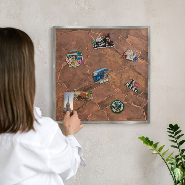 Souvenir magnet display board with a silver frame Stone structure