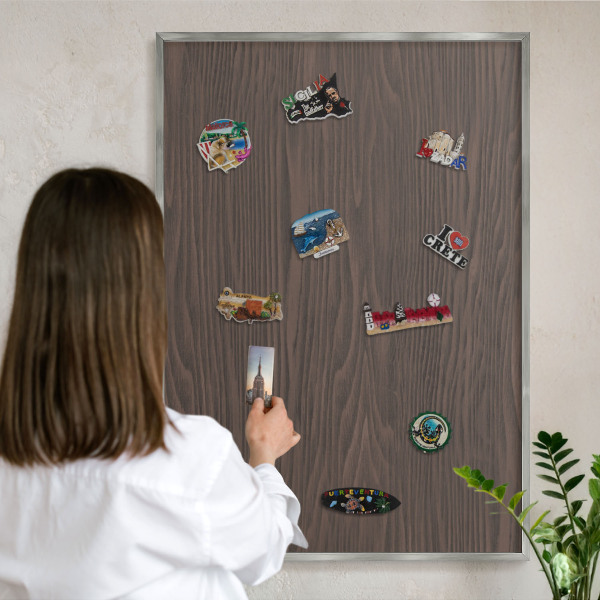 Souvenir magnet display board with a silver frame Natural wood