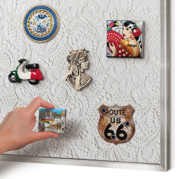 Souvenir magnet display board with a silver frame Openwork elegance