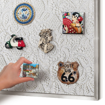 Souvenir magnet display board with a silver frame Openwork elegance