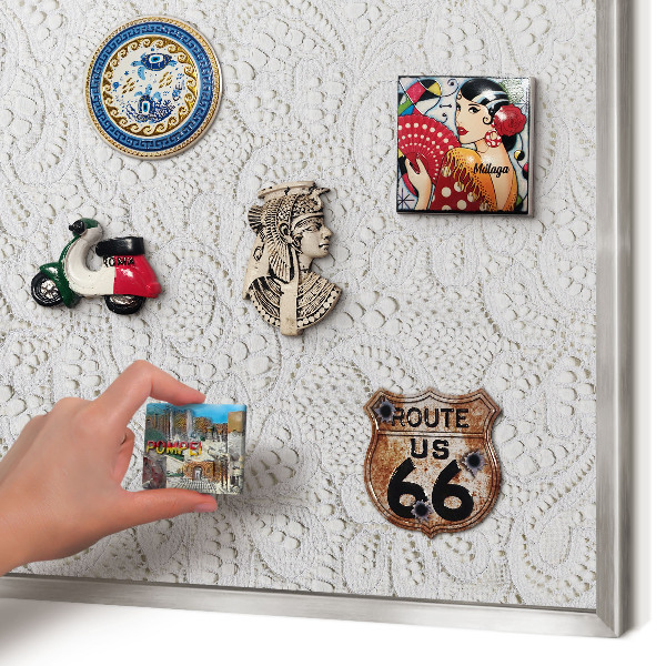 Souvenir magnet display board with a silver frame Openwork elegance