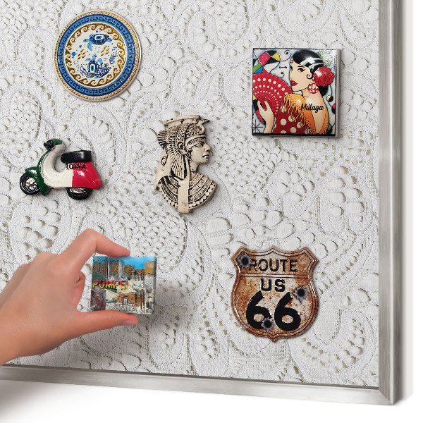 Souvenir magnet display board with a silver frame Openwork elegance