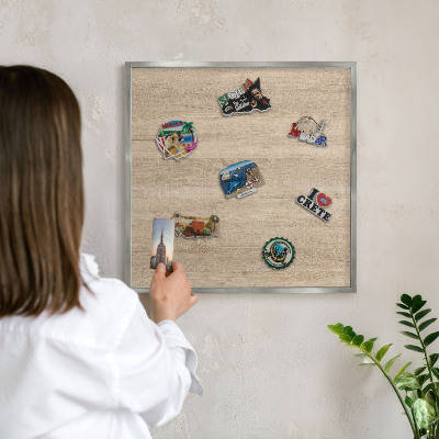 Printed magnet board in a silver frame Wooden background