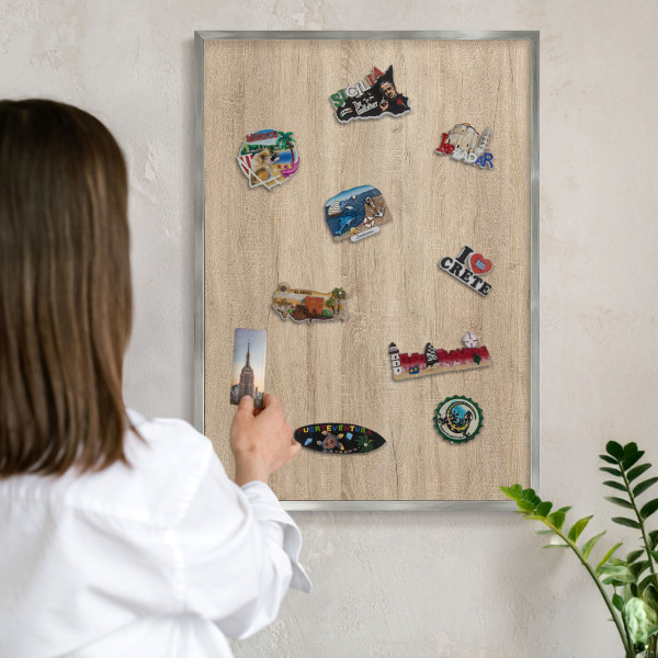 Printed magnet board in a silver frame Wooden background
