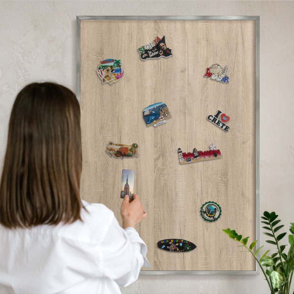Printed magnet board in a silver frame Wooden background
