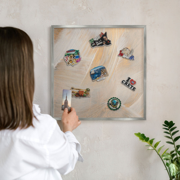 Souvenir magnet display board with a silver frame Elegant abstraction