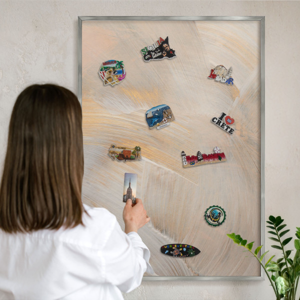Souvenir magnet display board with a silver frame Elegant abstraction