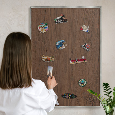 Souvenir magnet display board with a silver frame Wooden texture