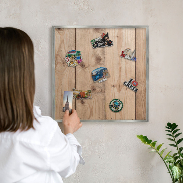 Souvenir magnet display board with a silver frame Wooden texture