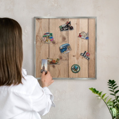 Souvenir magnet display board with a silver frame Wooden texture