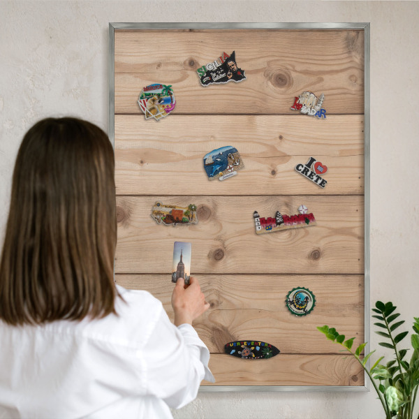 Souvenir magnet display board with a silver frame Wooden texture