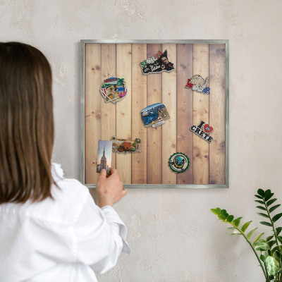Souvenir magnet display board with a silver frame Wooden boards