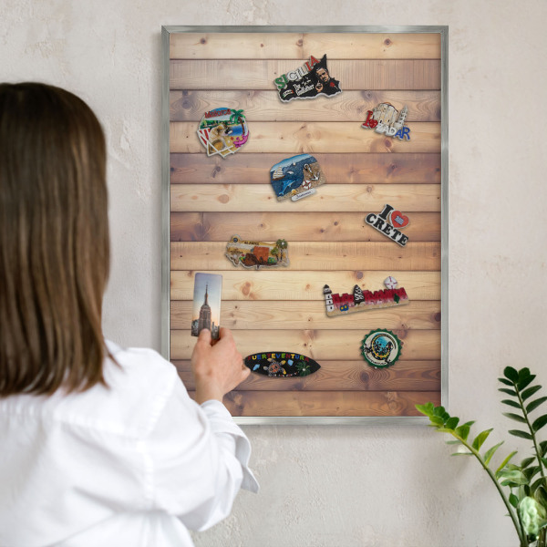 Souvenir magnet display board with a silver frame Wooden boards