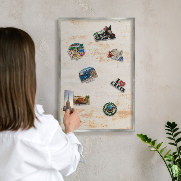 Souvenir magnet display board with a silver frame Rusty texture