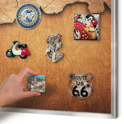 Souvenir magnet display board with a silver frame Wooden texture