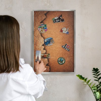 Souvenir magnet display board with a silver frame Wooden texture