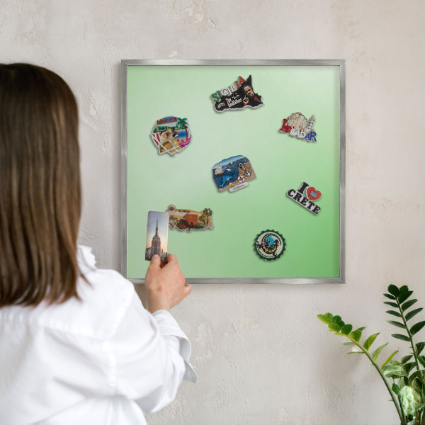 Souvenir magnet display board with a silver frame Green harmony