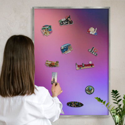 Souvenir magnet display board with a silver frame Colors of harmony