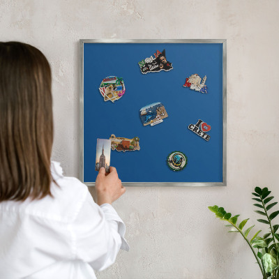 Souvenir magnet display board with a silver frame Dark blue