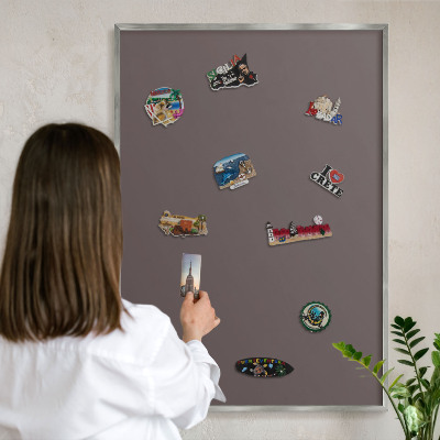Souvenir magnet display board with a silver frame Faded brown