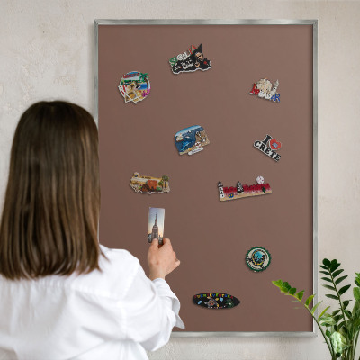 Souvenir magnet display board with a silver frame Brown color