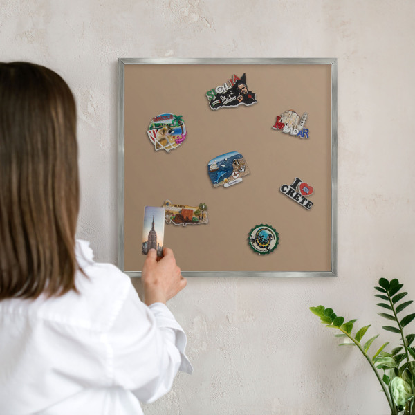 Souvenir magnet display board with a silver frame Warm light brown