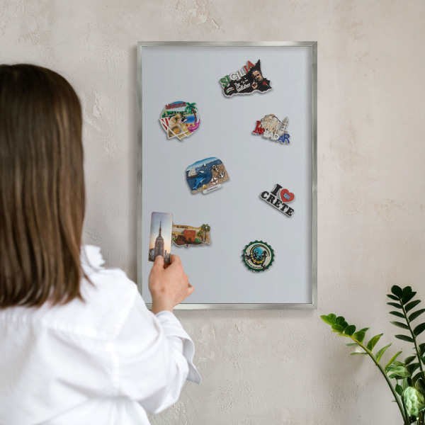Souvenir magnet display board with a silver frame Light gray