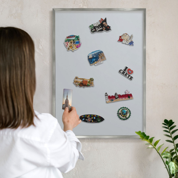 Souvenir magnet display board with a silver frame Light gray