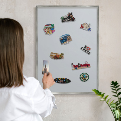 Souvenir magnet display board with a silver frame Light gray