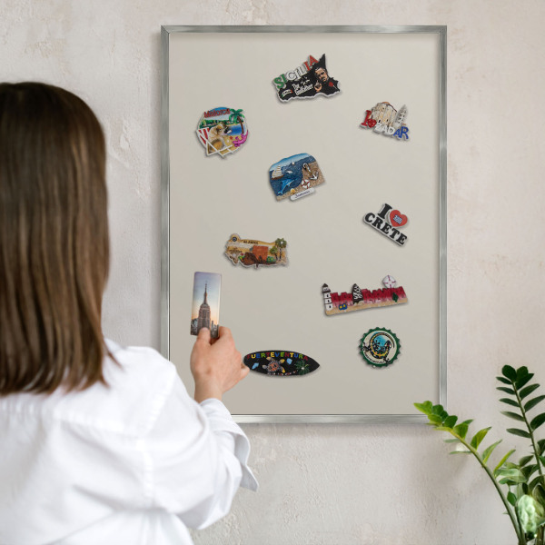 Souvenir magnet display board with a silver frame Warm stone