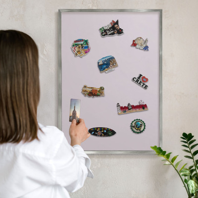 Souvenir magnet display board with a silver frame Light lilac
