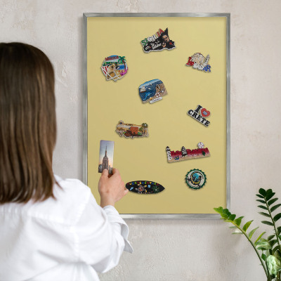 Souvenir magnet display board with a silver frame Vintage yellow