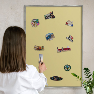 Souvenir magnet display board with a silver frame Vintage yellow