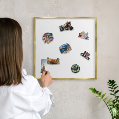 Magnetic board for magnets in a gold frame Pure white