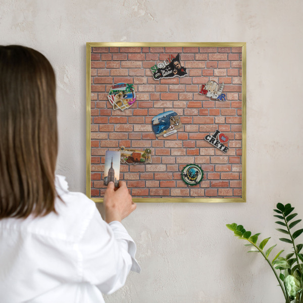 Magnetic board for magnets in a gold frame Brick wall