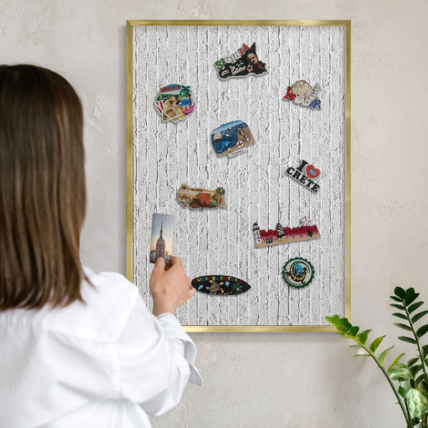 Metal magnet board with a gold frame Brick wall