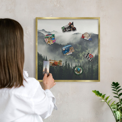 Metal magnet board with a gold frame Green mountains