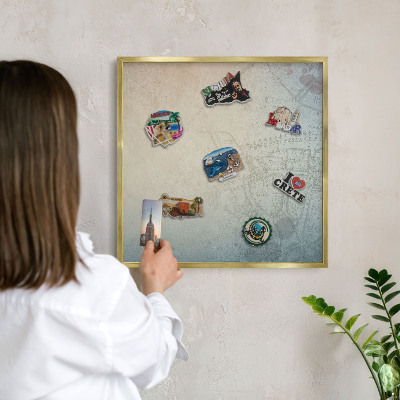 Metal magnet board with a gold frame Old map