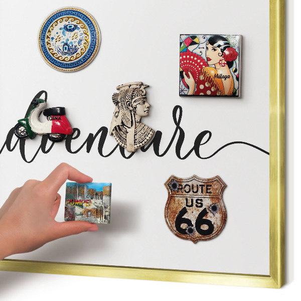 Metal magnet board with a gold frame Adventure written