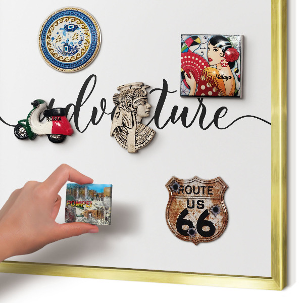 Metal magnet board with a gold frame Adventure written