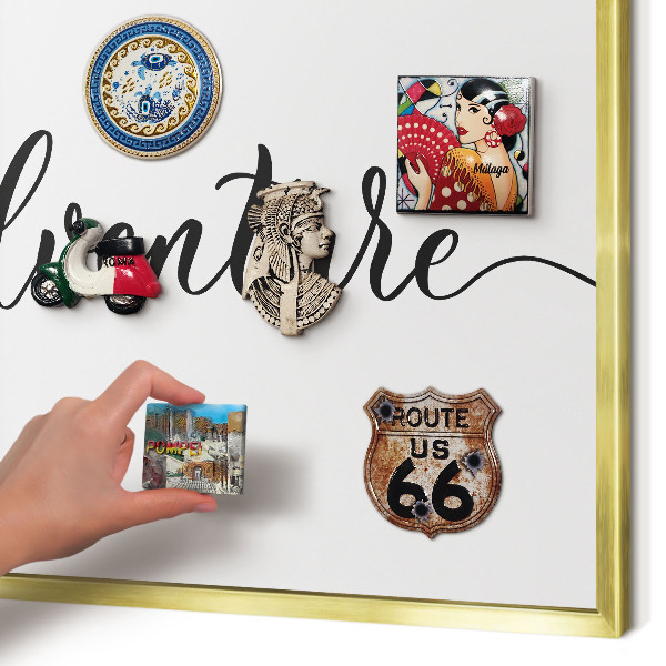 Metal magnet board with a gold frame Adventure written
