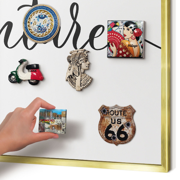 Metal magnet board with a gold frame Adventure written