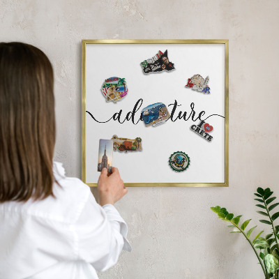 Metal magnet board with a gold frame Adventure written