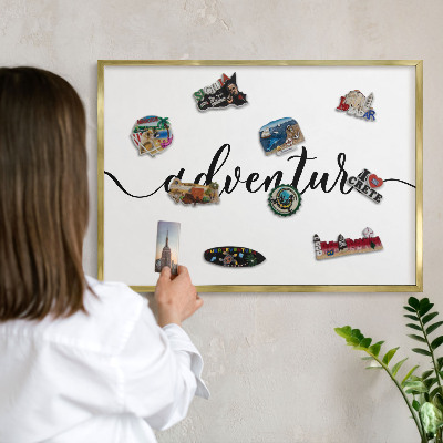 Metal magnet board with a gold frame Adventure written