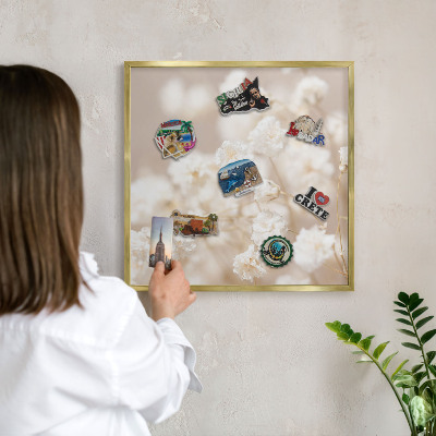 Metal magnet board with a gold frame Beige flowers